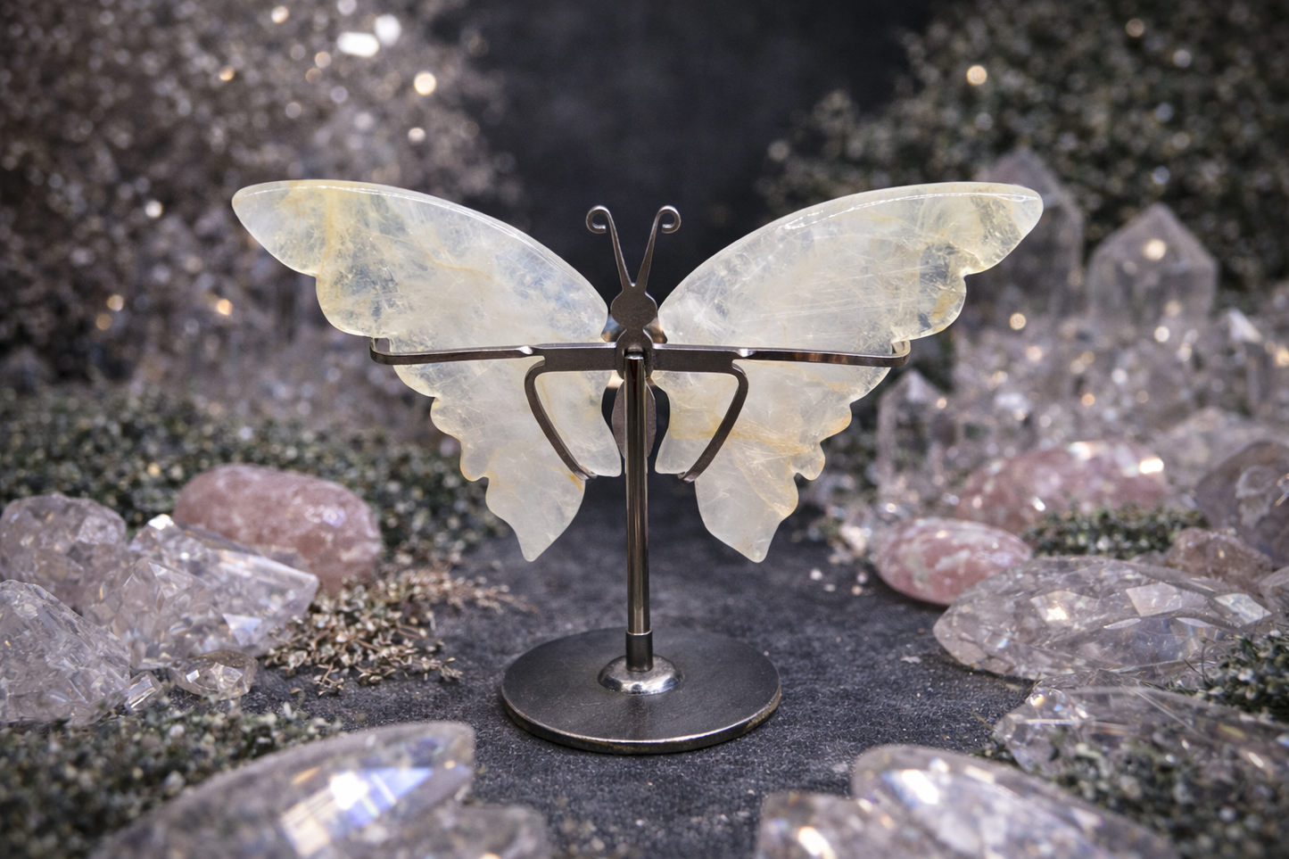 Butterfly-shaped object on a stand with a sparkling background